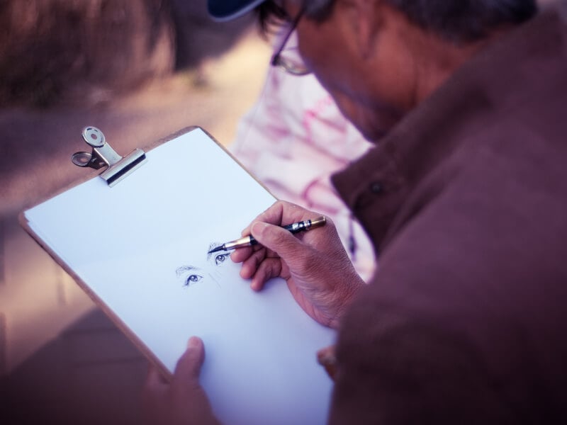 An artist sketches a portrait
